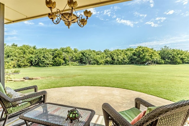 775 Magnolia Ln, Tuttle, OK 73089 - view of patio / terrace featuring view of wooded area