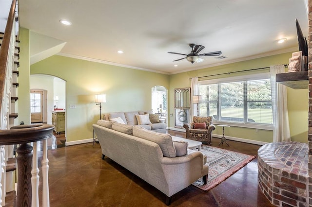 775 Magnolia Ln, Tuttle, OK 73089 - living area with arched walkways, concrete flooring, ceiling fan, plenty of natural light, and recessed lighting