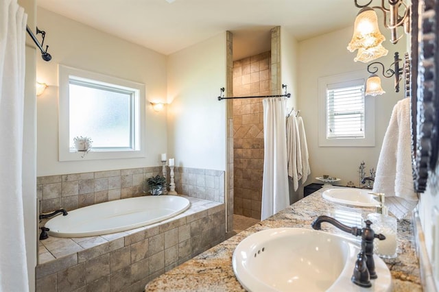 775 Magnolia Ln, Tuttle, OK 73089 - full bathroom featuring a garden tub, tiled shower, and double vanity