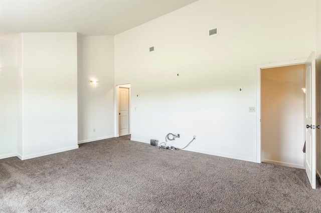 775 Magnolia Ln, Tuttle, OK 73089 - unfurnished room with high vaulted ceiling and carpet