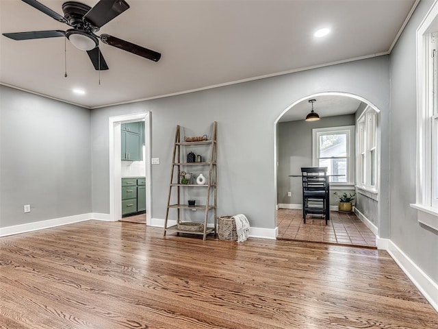 1623 NW 39th St, Oklahoma City, OK 73118 - living area with arched walkways, wood finished floors, a ceiling fan, ornamental molding, and recessed lighting