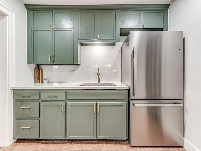 1623 NW 39th St, Oklahoma City, OK 73118 - kitchen featuring freestanding refrigerator, green cabinetry, and light countertops