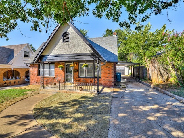 1623 NW 39th St, Oklahoma City, OK 73118 - view of front of property featuring covered porch, driveway, brick siding, a chimney, and an attached carport