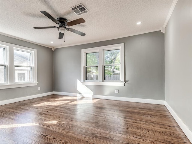 1623 NW 39th St, Oklahoma City, OK 73118 - unfurnished room featuring plenty of natural light, wood finished floors, ceiling fan, ornamental molding, and recessed lighting