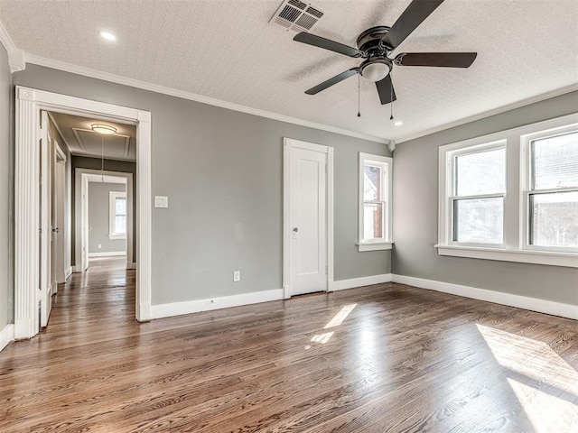 1623 NW 39th St, Oklahoma City, OK 73118 - unfurnished bedroom with attic access, wood finished floors, crown molding, a closet, and ceiling fan