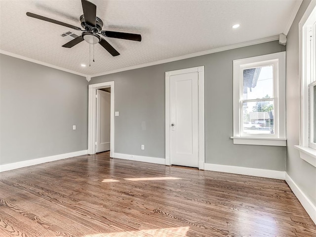 1623 NW 39th St, Oklahoma City, OK 73118 - spare room with a ceiling fan, wood finished floors, recessed lighting, and crown molding