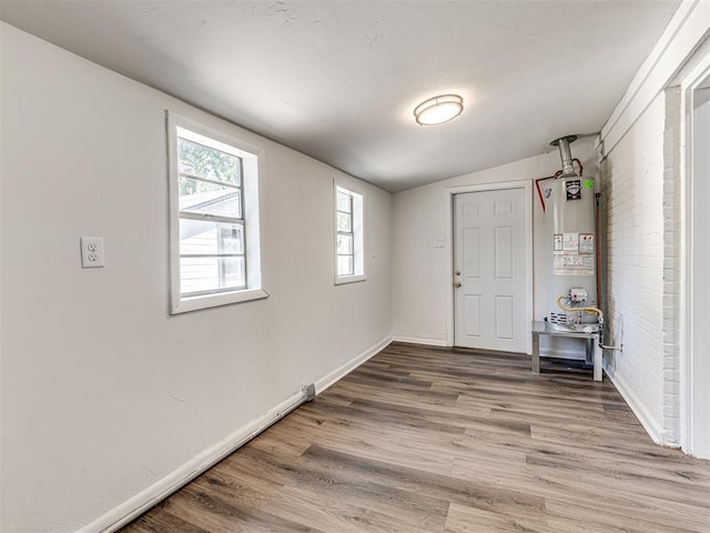 1623 NW 39th St, Oklahoma City, OK 73118 - foyer entrance featuring gas water heater, wood finished floors, and vaulted ceiling