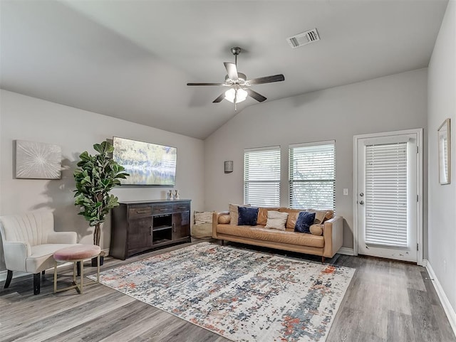 3529 Slate River Dr, Yukon, OK 73099 - living room with wood finished floors, vaulted ceiling, and a ceiling fan