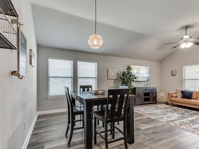 3529 Slate River Dr, Yukon, OK 73099 - dining space with lofted ceiling, wood finished floors, ceiling fan, and a chandelier