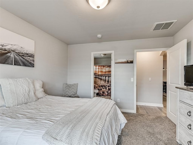 3529 Slate River Dr, Yukon, OK 73099 - bedroom featuring light carpet and ensuite bath