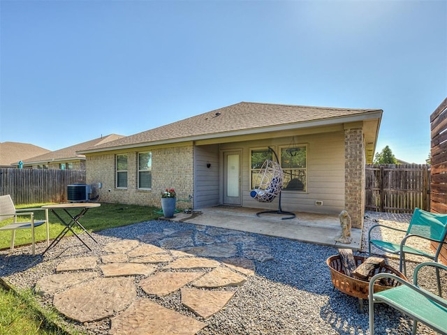 3529 Slate River Dr, Yukon, OK 73099 - rear view of house featuring a patio area, a fenced backyard, brick siding, and a shingled roof