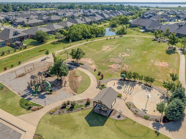 3529 Slate River Dr, Yukon, OK 73099 - aerial perspective of suburban area featuring a large body of water