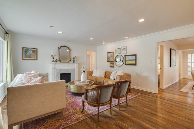 1114 Glenwood Ave, Nichols Hills, OK 73116 - living area featuring wood finished floors, ornamental molding, a high end fireplace, and recessed lighting