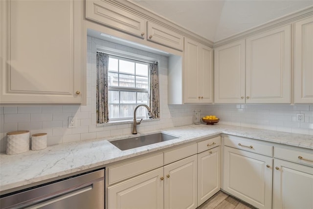 1114 Glenwood Ave, Nichols Hills, OK 73116 - kitchen featuring stainless steel dishwasher, tasteful backsplash, and light stone counters