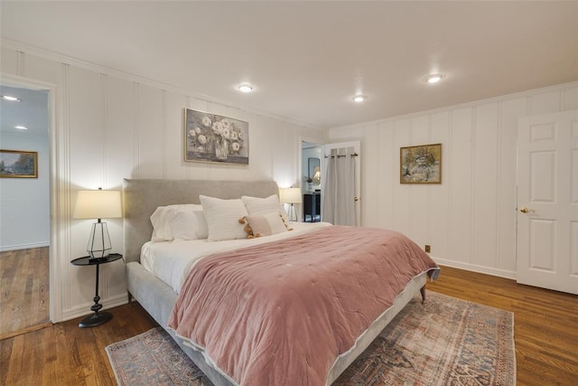1114 Glenwood Ave, Nichols Hills, OK 73116 - bedroom with ornamental molding, wood finished floors, a decorative wall, and recessed lighting