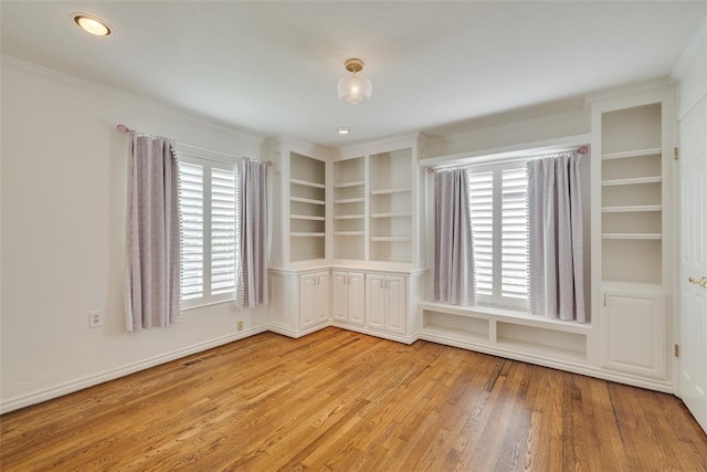 1114 Glenwood Ave, Nichols Hills, OK 73116 - spare room featuring light wood-type flooring and ornamental molding