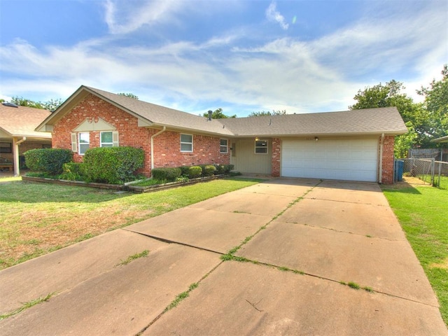 3013 Beverly Dr, Edmond, OK 73013 - view of front of property with brick siding, a garage, and driveway