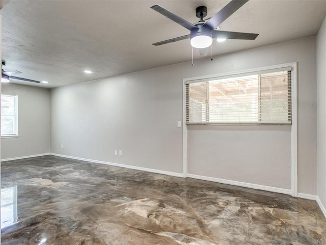3013 Beverly Dr, Edmond, OK 73013 - unfurnished room featuring a ceiling fan and concrete floors