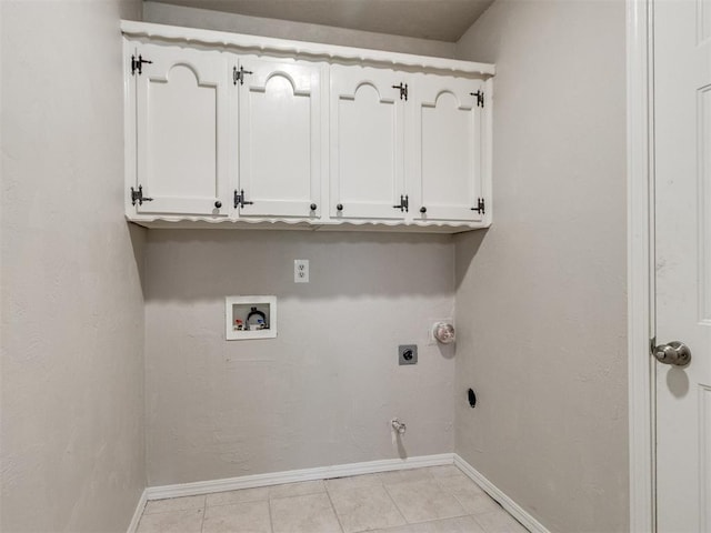 3013 Beverly Dr, Edmond, OK 73013 - laundry room featuring electric dryer hookup, hookup for a gas dryer, cabinet space, washer hookup, and light tile patterned floors