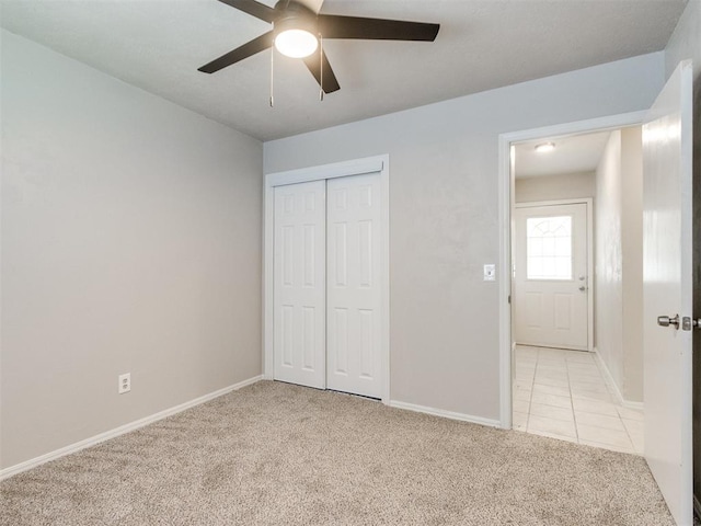 3013 Beverly Dr, Edmond, OK 73013 - unfurnished bedroom with light carpet, a closet, and a ceiling fan
