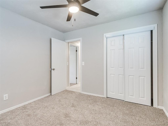 3013 Beverly Dr, Edmond, OK 73013 - unfurnished bedroom with carpet flooring, a closet, and a ceiling fan
