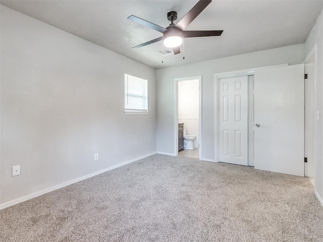 3013 Beverly Dr, Edmond, OK 73013 - unfurnished bedroom with carpet, a closet, ensuite bath, and ceiling fan
