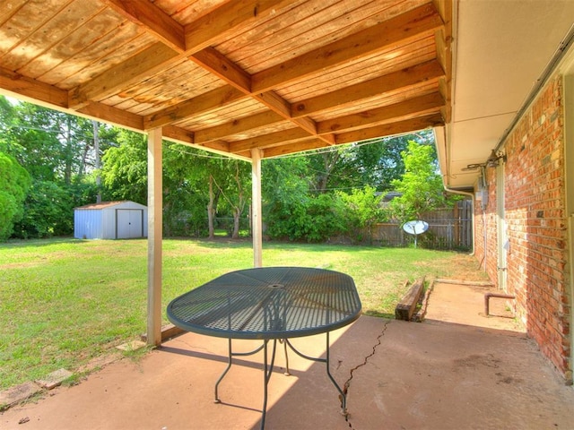 3013 Beverly Dr, Edmond, OK 73013 - fenced backyard with a patio area, a storage unit, and view of wooded area