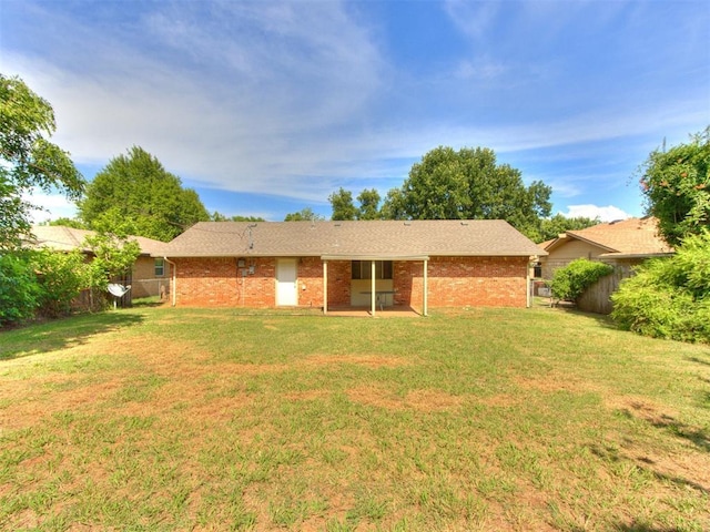3013 Beverly Dr, Edmond, OK 73013 - back of property with brick siding and a patio area