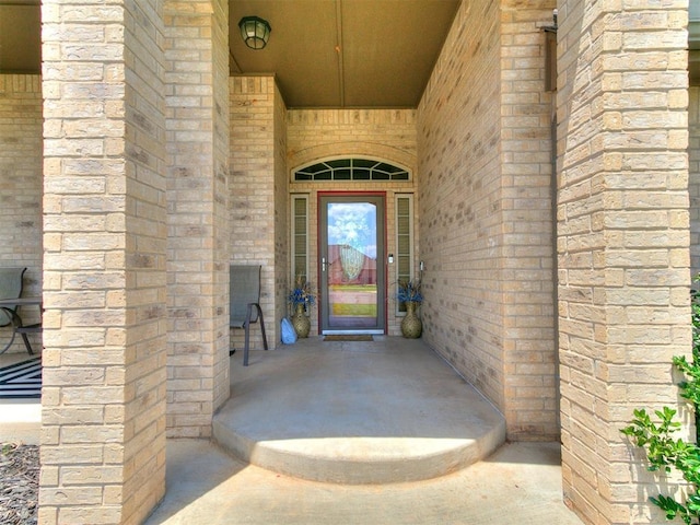 property entrance featuring stone siding