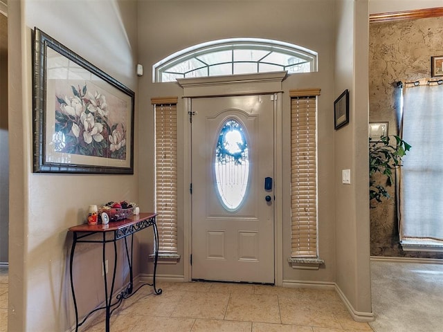tiled entryway with plenty of natural light