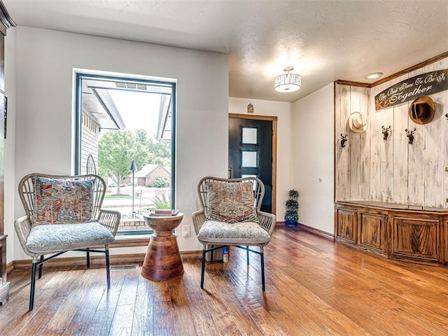 1521 Spring Creek Dr, Yukon, OK 73099 - sitting room featuring hardwood / wood-style floors and a textured ceiling