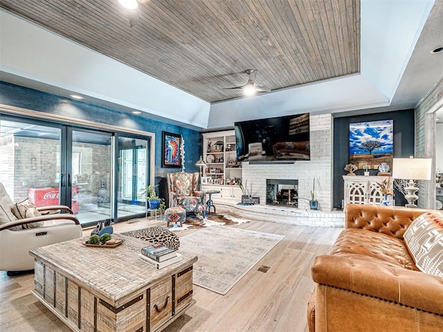 1521 Spring Creek Dr, Yukon, OK 73099 - living area featuring wood finished floors, french doors, a fireplace, a ceiling fan, and lofted ceiling