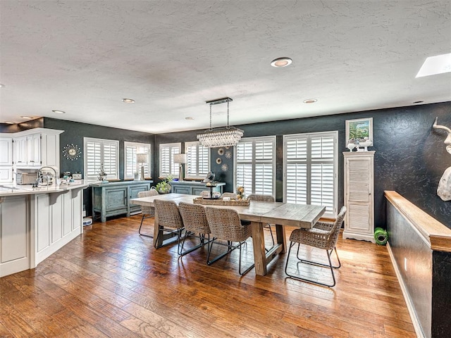 1521 Spring Creek Dr, Yukon, OK 73099 - dining area featuring a textured ceiling, hardwood / wood-style flooring, and plenty of natural light