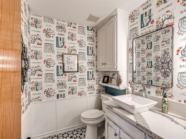 1521 Spring Creek Dr, Yukon, OK 73099 - bathroom featuring vanity and wainscoting