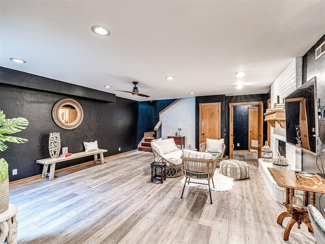 1521 Spring Creek Dr, Yukon, OK 73099 - living area with wood finished floors, stairway, ceiling fan, recessed lighting, and a fireplace