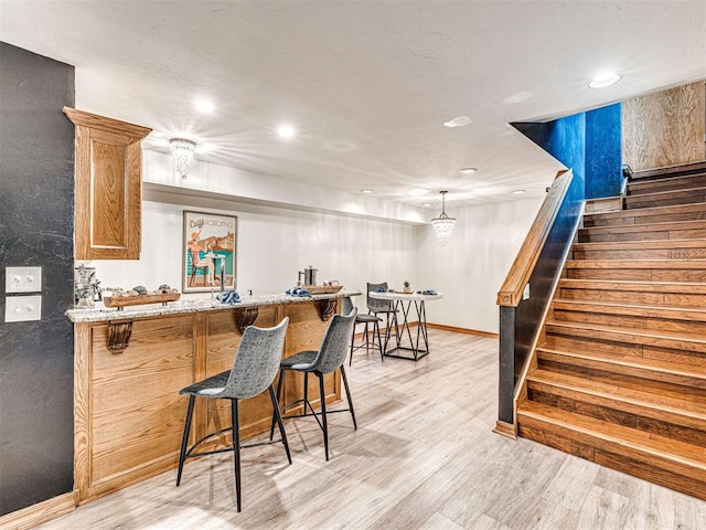 1521 Spring Creek Dr, Yukon, OK 73099 - indoor bar with stairway, light wood-style flooring, and recessed lighting