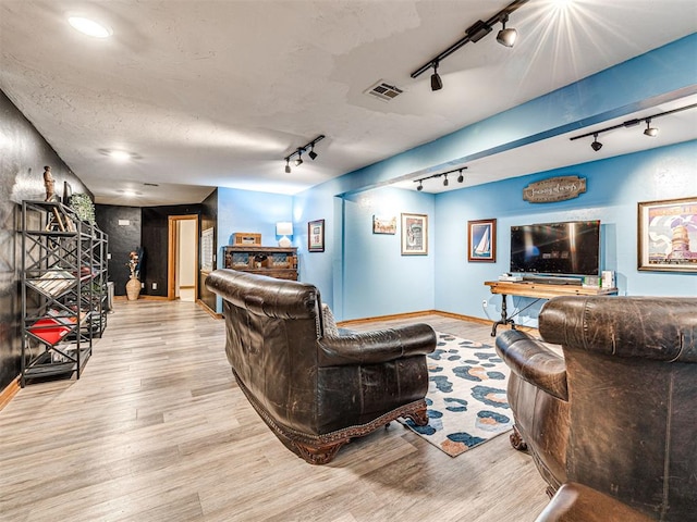 1521 Spring Creek Dr, Yukon, OK 73099 - living area with rail lighting and wood finished floors