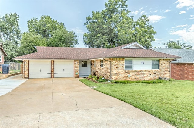 27 NE 65th St, Oklahoma City, OK 73105 - ranch-style house with brick siding, concrete driveway, an attached garage, and roof with shingles