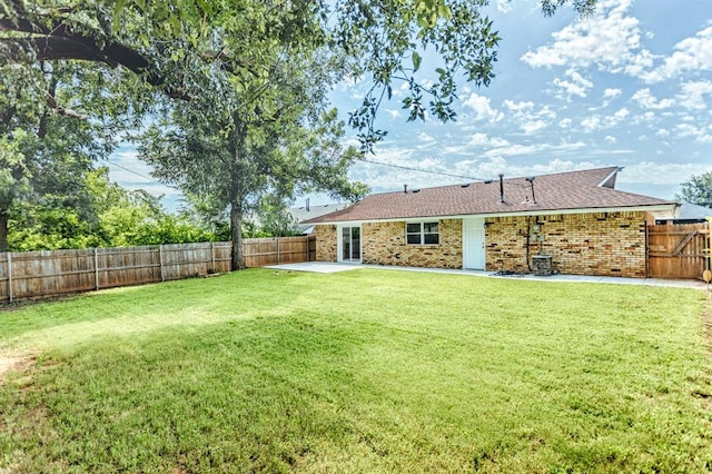 27 NE 65th St, Oklahoma City, OK 73105 - fenced backyard featuring a patio