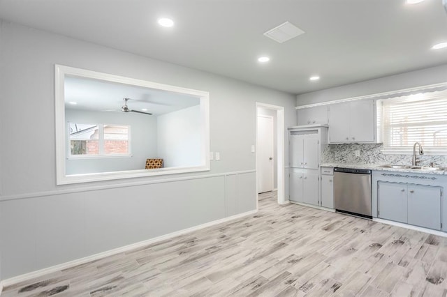 27 NE 65th St, Oklahoma City, OK 73105 - kitchen with dishwasher, light wood-style floors, healthy amount of natural light, decorative backsplash, and recessed lighting