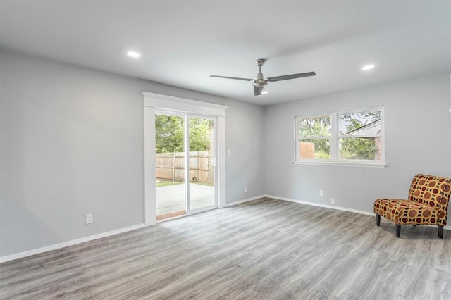 27 NE 65th St, Oklahoma City, OK 73105 - unfurnished room featuring plenty of natural light, wood finished floors, a ceiling fan, and recessed lighting