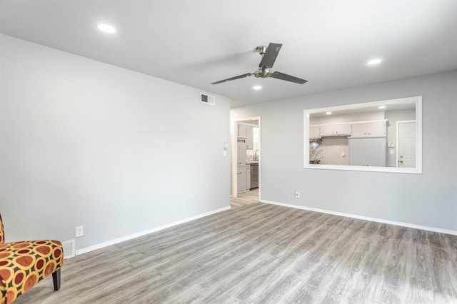 27 NE 65th St, Oklahoma City, OK 73105 - unfurnished room featuring light wood-type flooring, a ceiling fan, and recessed lighting