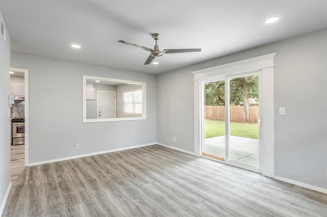27 NE 65th St, Oklahoma City, OK 73105 - spare room featuring a ceiling fan, wood finished floors, healthy amount of natural light, and recessed lighting