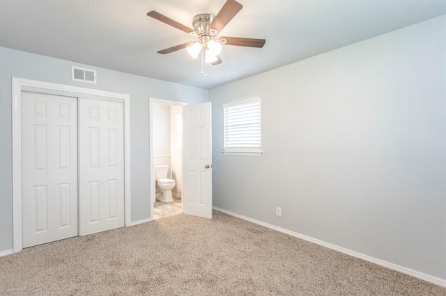 27 NE 65th St, Oklahoma City, OK 73105 - unfurnished bedroom with carpet floors, a closet, connected bathroom, and a ceiling fan