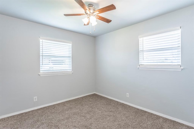 27 NE 65th St, Oklahoma City, OK 73105 - empty room with carpet floors, plenty of natural light, and a ceiling fan