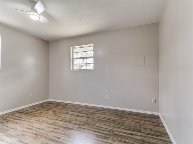 111 S Bristow Ave, Moore, OK 73160 - unfurnished room featuring dark wood-type flooring and ceiling fan