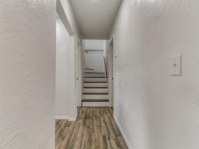 111 S Bristow Ave, Moore, OK 73160 - hallway featuring wood finished floors, stairs, and a textured wall