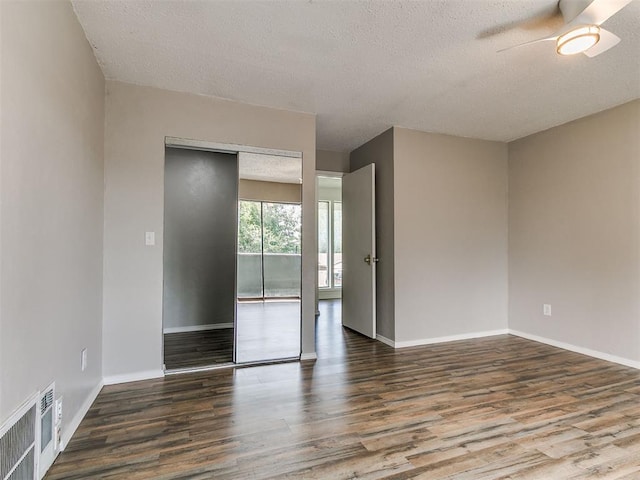 111 S Bristow Ave, Moore, OK 73160 - unfurnished room featuring wood finished floors, a textured ceiling, and a ceiling fan