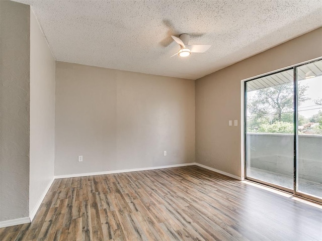 111 S Bristow Ave, Moore, OK 73160 - spare room with ceiling fan, wood finished floors, and a textured ceiling