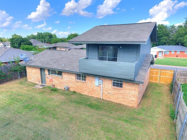 111 S Bristow Ave, Moore, OK 73160 - back of house with brick siding, a fenced backyard, and a shingled roof